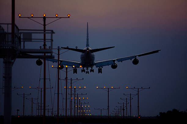 istock Airplane landing at dusk 172307574