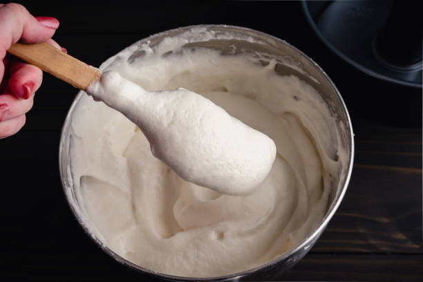 istock Hand Holding a Spatula with Freshly Mixed Angel Food Cake Batter 1723084198
