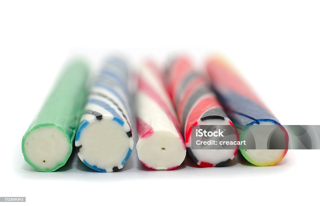 Barras adhesivas de colores de rock en una fila en blanco - Foto de stock de Cinco objetos libre de derechos