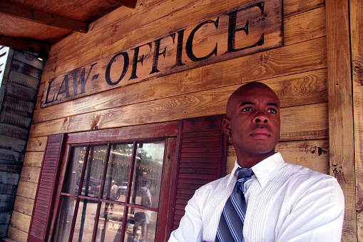 A lawyer outside his law office.