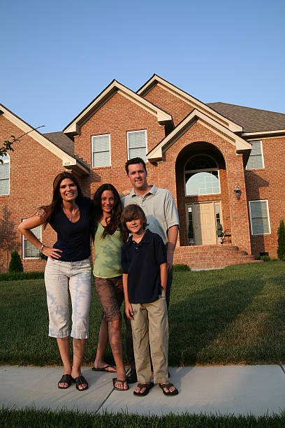 istock Family in front of brick house 172309662