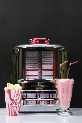 Tabletop Jukebox with popcorn and Strawberry Milkshake.