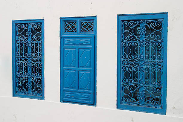 the moucharabieh which adorn windows, loggias and balconies, with their classic Arabic ornaments, they decorate the blue and white houses of the village of Sidi Bou Saïd. Tunisia