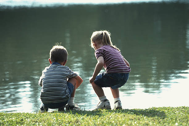 istock kids by the pond 172311378