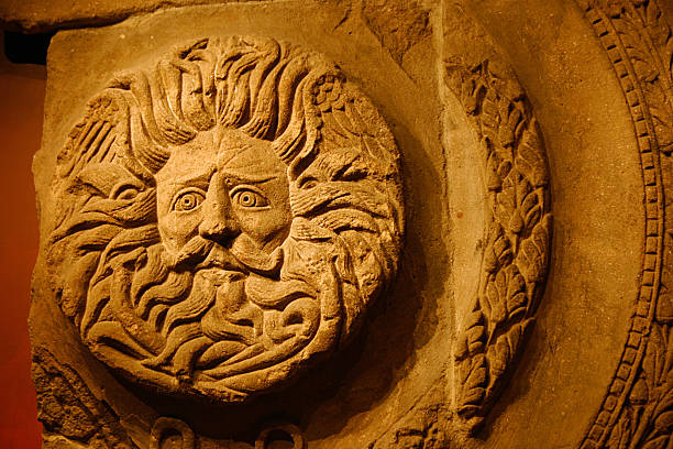 Romano-Celtic Gorgon's Head, Sun God, Roman Baths, Bath Part of the artifacts which is included in the Roman Bath, this stone etched Sun God (which is beleived to be a Gorgon) was uncovered in the ruins of the Roman Baths, during the period when the Roman Empire occupied the Roman Baths in Bath, England. This artifact It is still in the ruins of the Roman Bathhouse, a major tourist destination in the UK. bath abbey stock pictures, royalty-free photos & images