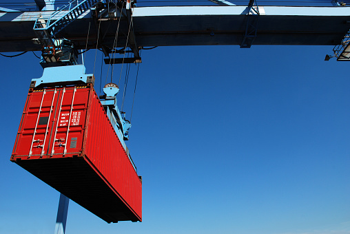 Lifting a container from stack to a ship.Please see similar pictures from my portfolio: