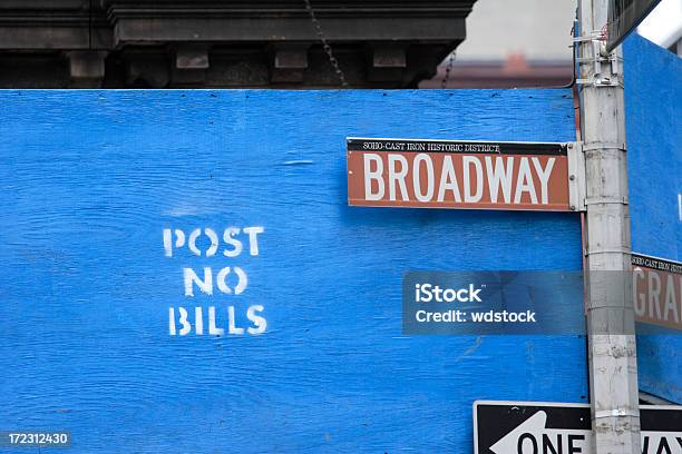 Broadway Sign Against Post No Bills Stock Photo - Download Image Now - SoHo - New York, New York City, Billboard Posting