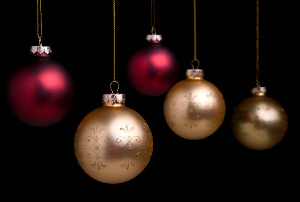 Elegant red and gold Christmas baubles on black uncropped.PLEASE CLICK ON THE IMAGE BELOW TO SEE MY CHRISTMAS PORTFOLIO: