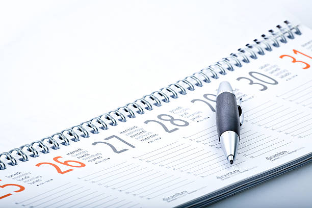 istock black wooden pen on calendar agenda 172312714