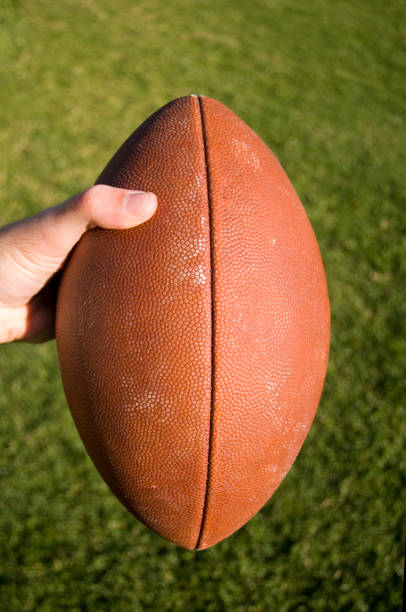 istock Football in the hand 172312936