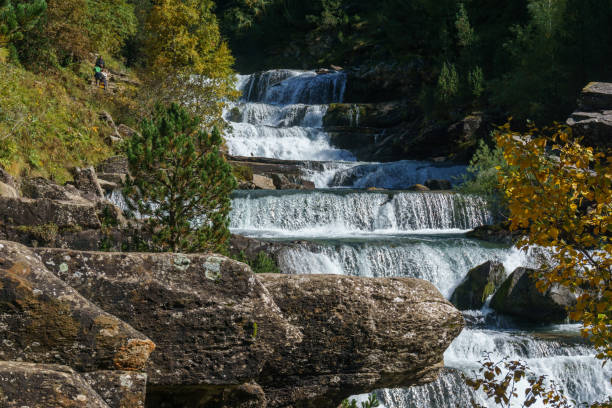 istock waterfall in Ordesa valley during autumn in the pyrenees mountains, Ordesa and Monte Perdido National Park, Huesca, Aragon, Spain 1723130103