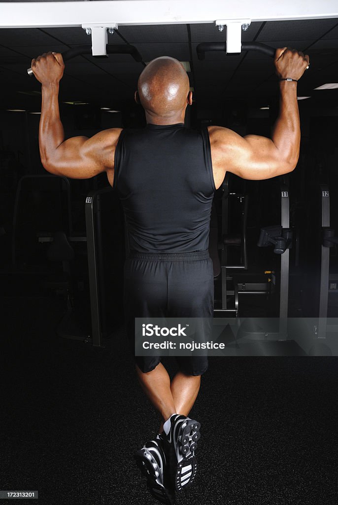 Pullup (rear view) "A muscular man in the middle of a pullup, from the rear" 35-39 Years Stock Photo