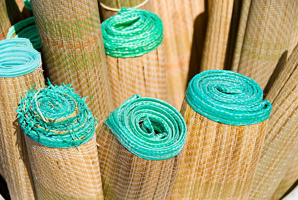 Straw Beach Mats Bundle of straw mats. beach mat stock pictures, royalty-free photos & images