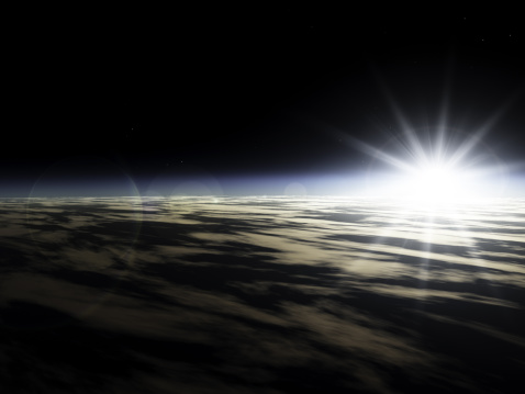 Sunrise from outer space. Sun just above the horizon.Part of