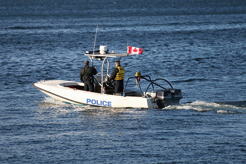 Police boat patrolling halifax harbor.