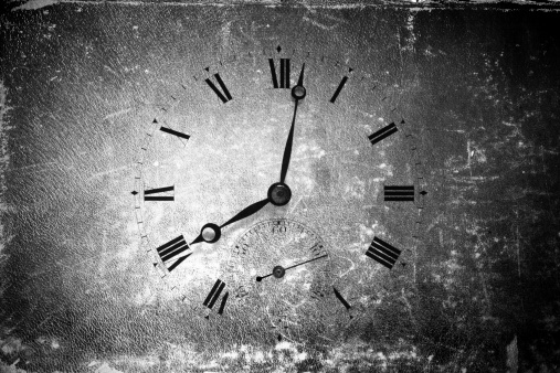 Old clock over grunge background