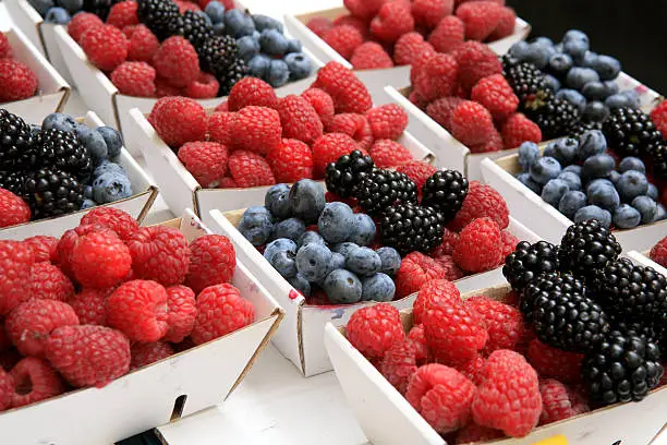 Photo of Fresh Raspberries Blackberries Blueberries at Market