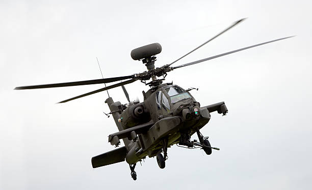 Large military helicopter in flight An Apache attack helicopter in flight weapon photos stock pictures, royalty-free photos & images