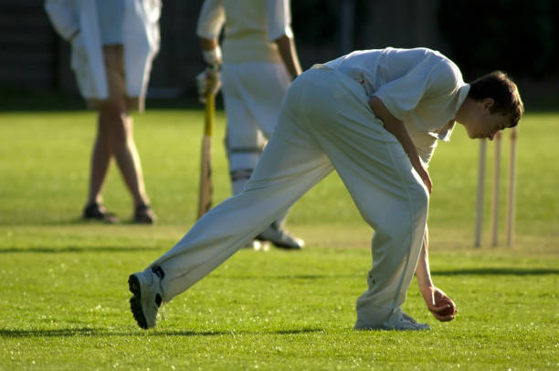 istock Fielder picking up ball during cricket game 172316444