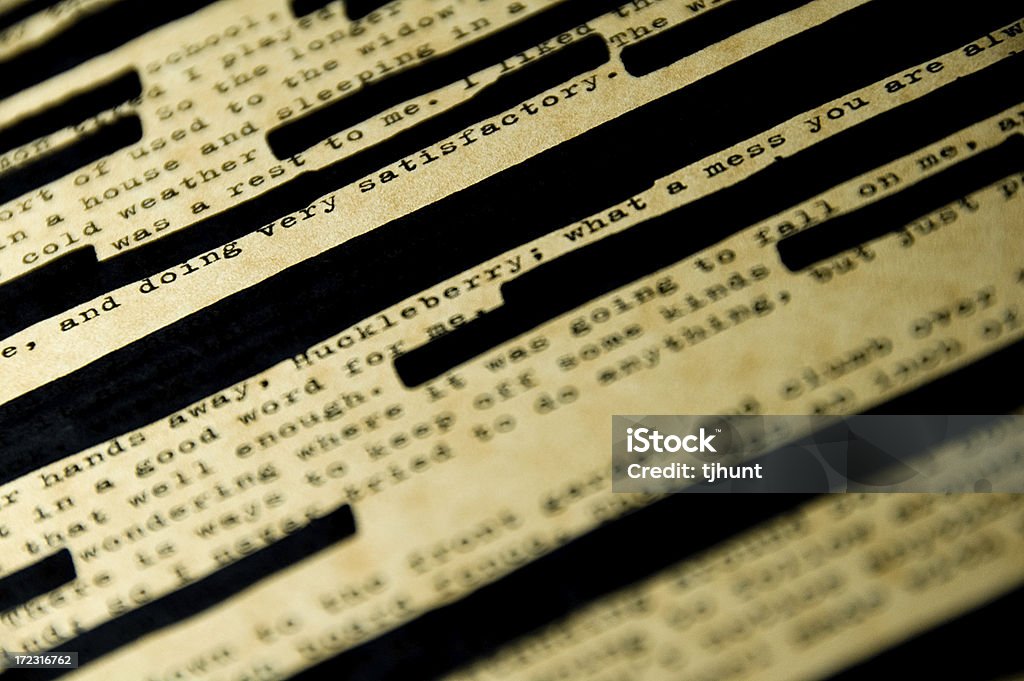 Censorship 2 "Book censorship, in this case, a page of Huckleberry Finn by Mark Twain. Slight antiqued effect with lots of redacted passages. Selective focus.Similar image:" Book Stock Photo