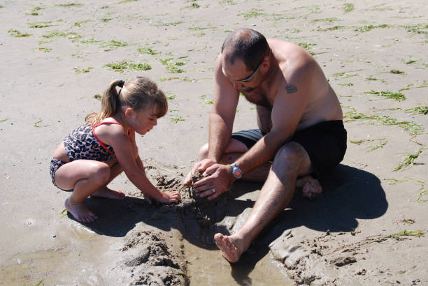 istock Building a Moat in the Sand with Daddy 172316810