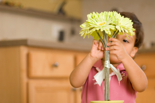 Child placing flowers