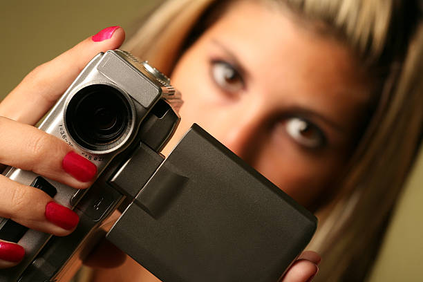 istock Cute girl holding Video Camera and Filming 172318352
