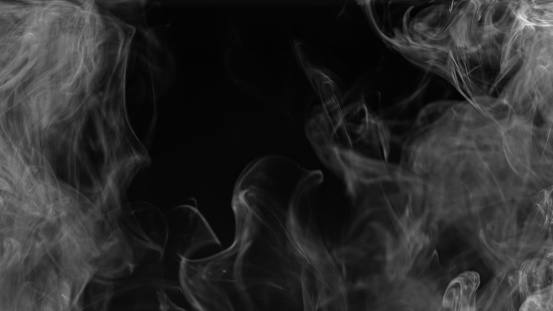 Smoke cloud. Vapor flow. Fume texture. Defocused transparent gray smog wave spreading on dark black copy space abstract background.