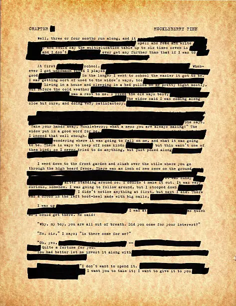 Book censorship, in this case, a page of Huckleberry Finn by Mark Twain. Old, antiqued and weathered effect with all sorts of redacted passages.