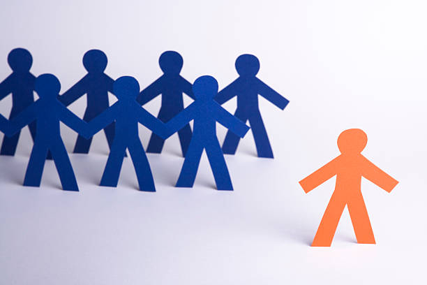 istock A paper person set apart from the group 172318824