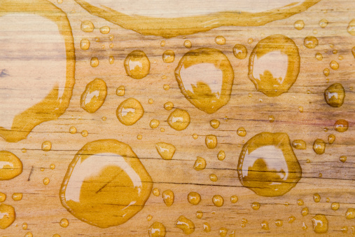 Water droplets on sealed wood
