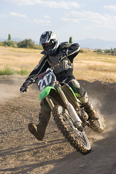 istock Motocross-rider racing around corner 172319001