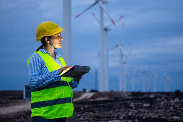 istock Pregnant wind energy engineer working late at wind farm. 1723195848