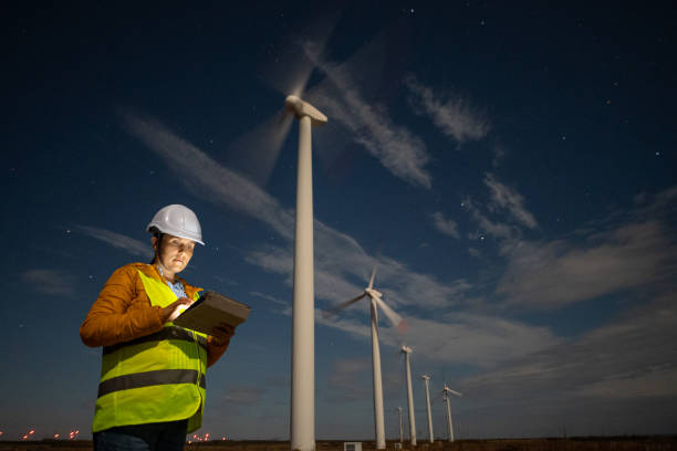 istock Pregnant wind energy engineer working late at wind farm. 1723195852