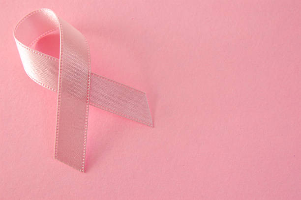 A pink ribbon representing breast cancer awareness stock photo