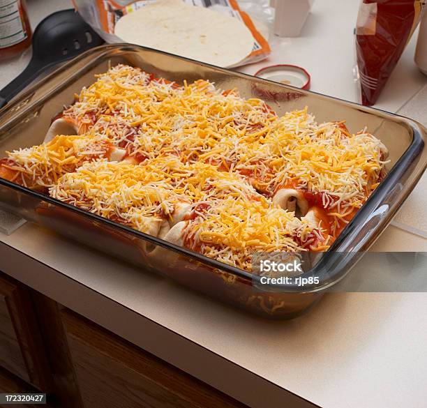 Enchiladas In The Kitchen Stock Photo - Download Image Now - Baking, Cheddar Cheese, Cheese