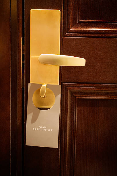 istock door with 'do not disturb' sign 172320646