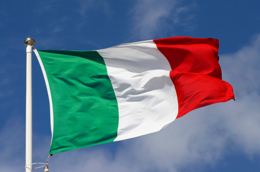 The Italian flag waving in the wind.