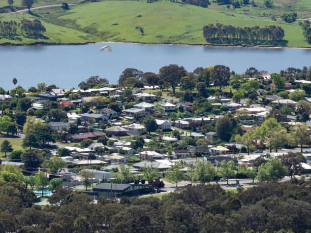 istock Town next to lake 1723212719