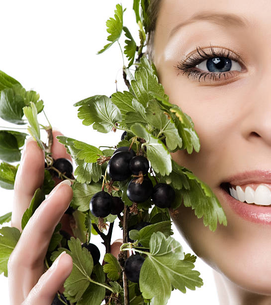Close-up of beautiful face with currant