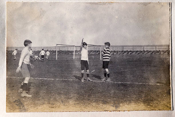 Vintage football Vintage photograph of a group of boys playing football. From the late victorian or early edwardian period. old football stock pictures, royalty-free photos & images