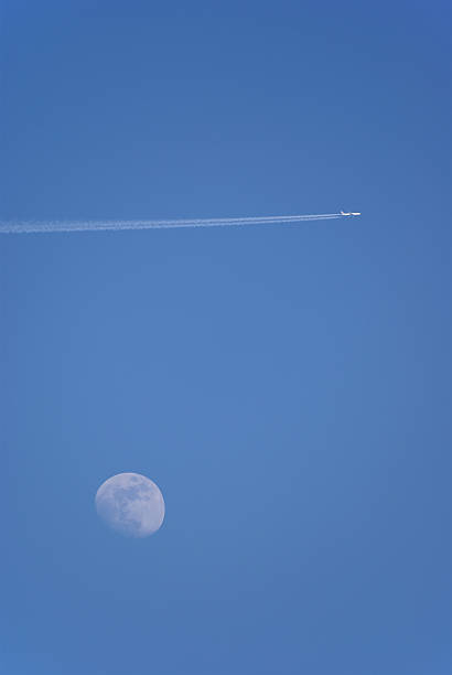 istock Airplane in the sky with moon 172321600