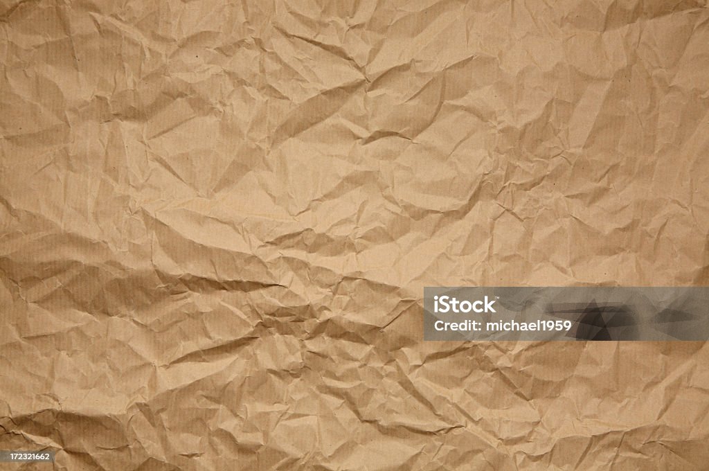Crumpled brown paper pattern or background Crumpled brown Paper from a package  as background texture. Textured Stock Photo