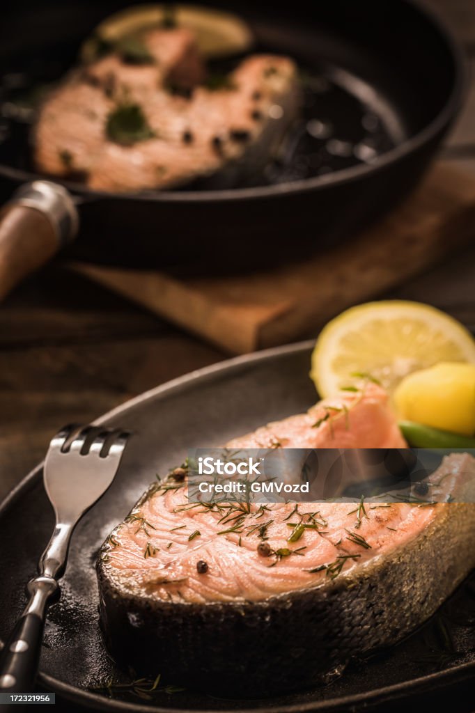 Salmon Steak Salmon steak with green beans, potato and tomato grilled in a pan Catch of Fish Stock Photo