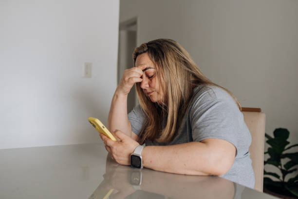 istock Worried woman using smartphone 1723225582