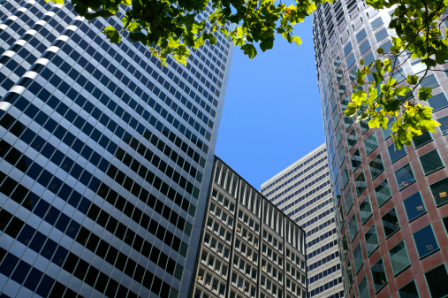 London, England - Oct 16, 2023 - Upward view of Skyscrapers in the business district area of One Canada Square in Canary Wharf. Tall structure architecture in the capital city. Architectural exterior view, Copy space, Selective focus.