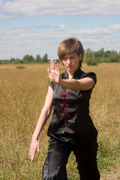 istock Young woman training Kung Fu outdoors 172323062