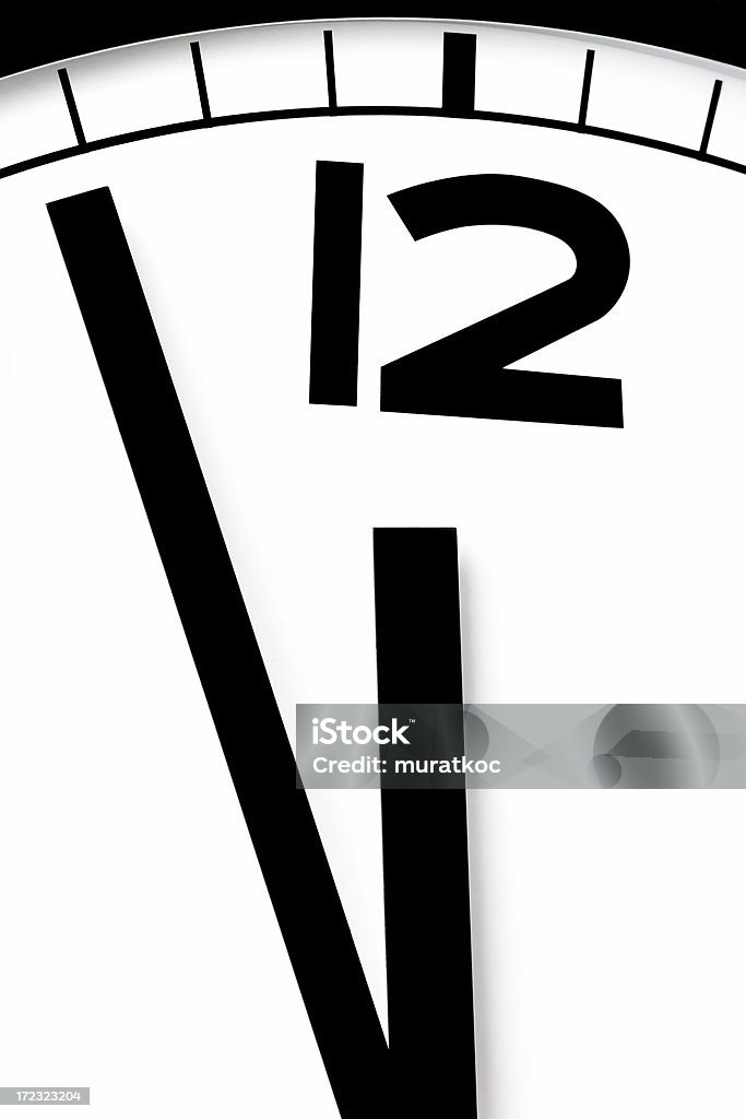 Few minutes to go close up of a wall clock 12 O'Clock Stock Photo