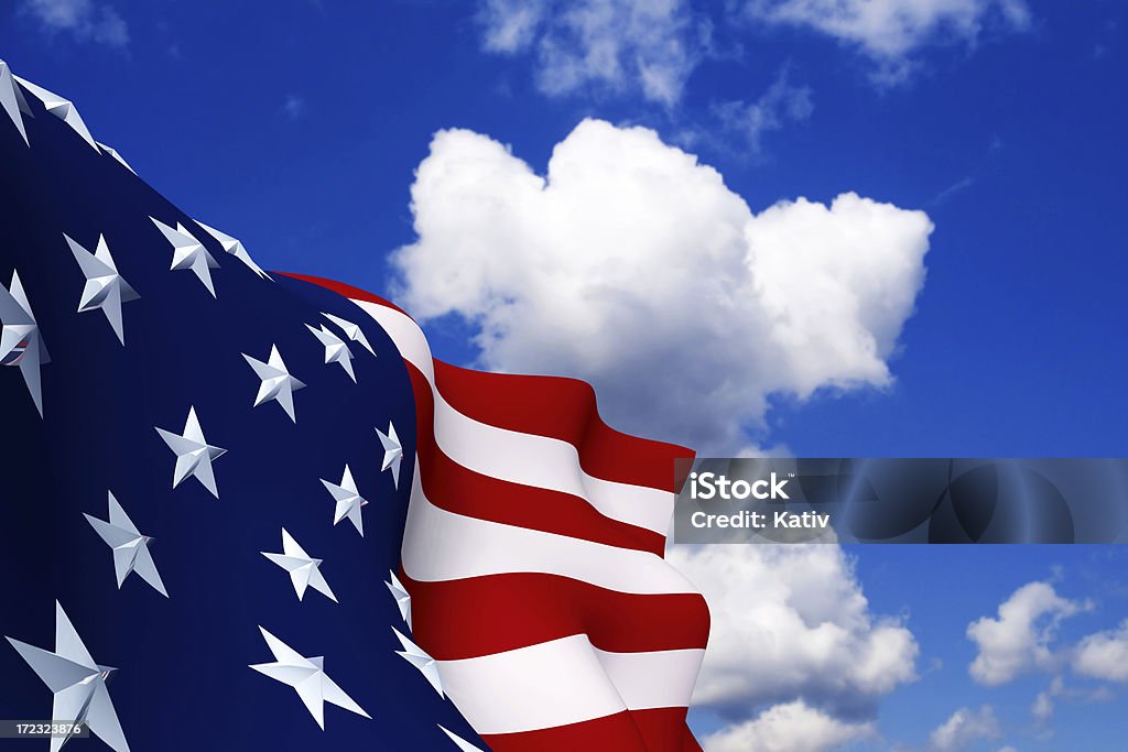 American Flag (XXL) Proud American Flag with Beveled Stars. Slightly blurred cloud sky background and focused on the flag. Fourth of July Stock Photo