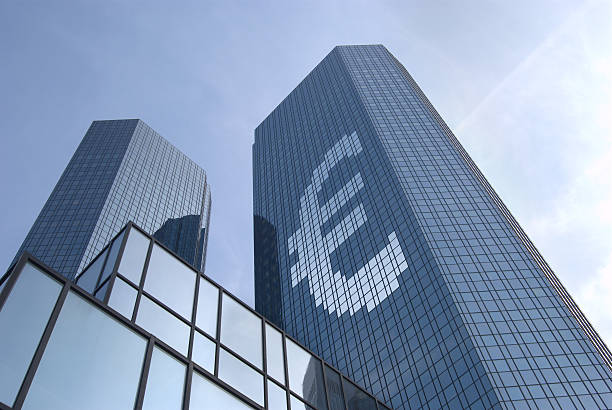 Concept Euro mirrored-glass skyscraper showing Eurosymbol on the facade european culture stock pictures, royalty-free photos & images